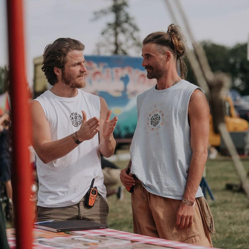 Two people talking at an outdoor The Way of Play event